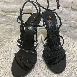 Black patent leather YSL Cassandra sandal